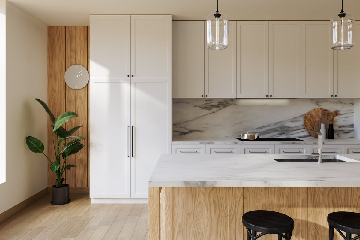 Close-up of empty modern kitchen with white cabinets and marble island